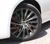 Red calipers visible through the spoked alloy wheel