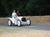 A vintage era Mercedes heads up the hill